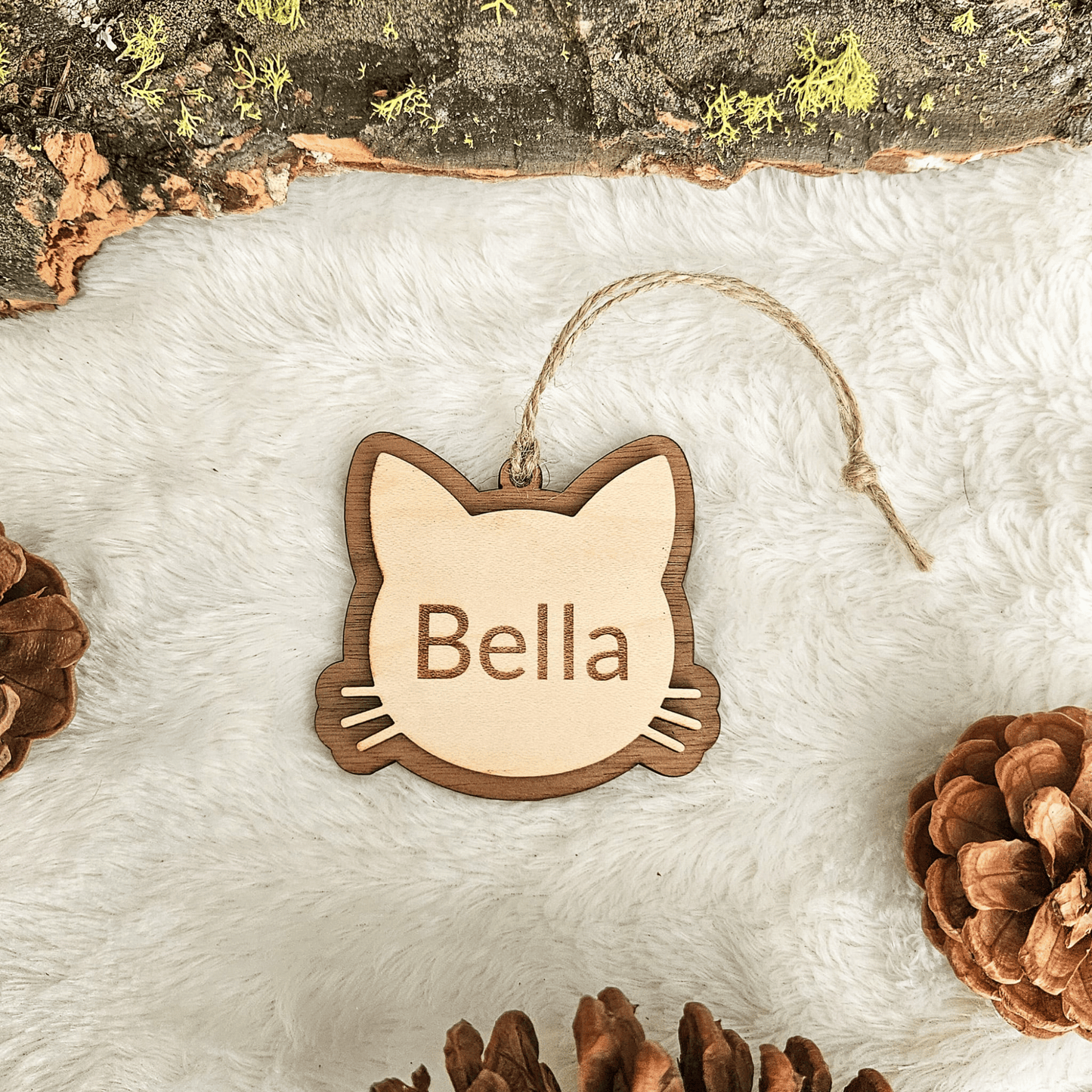 Layered wood personalized cat ornament showing engraved name Bella and handcrafted depth
