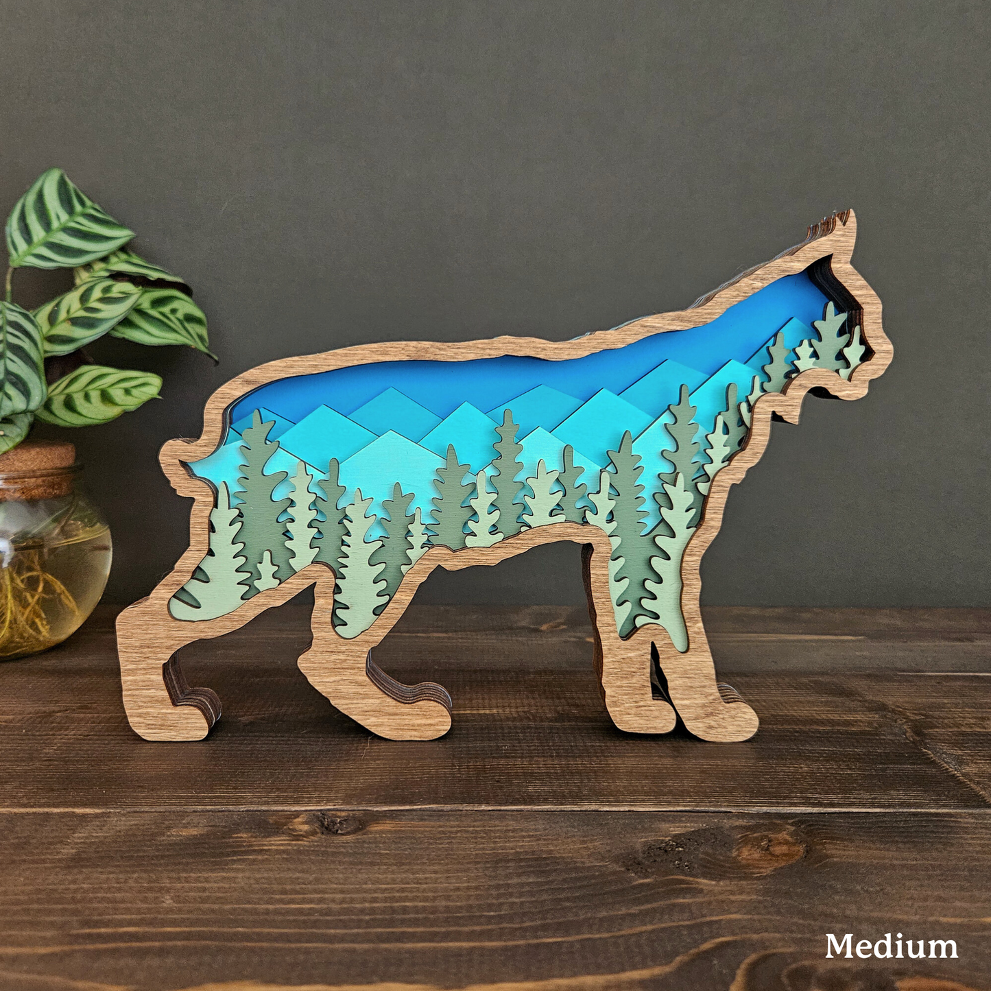 3D Bobcat Art with Mountains and Trees