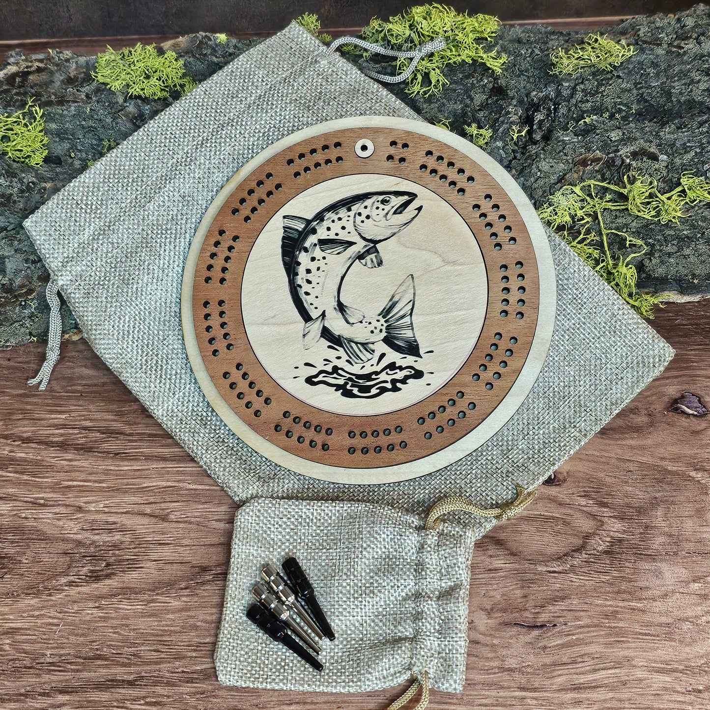 Travel cribbage board with trout design and metal pegs