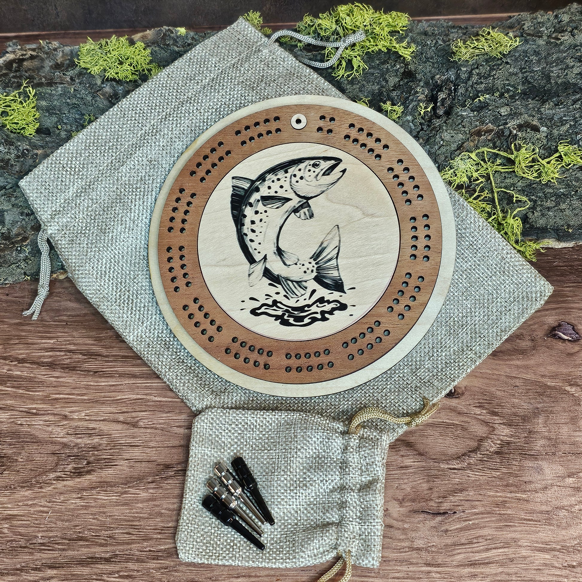 Travel cribbage board with trout design and metal pegs