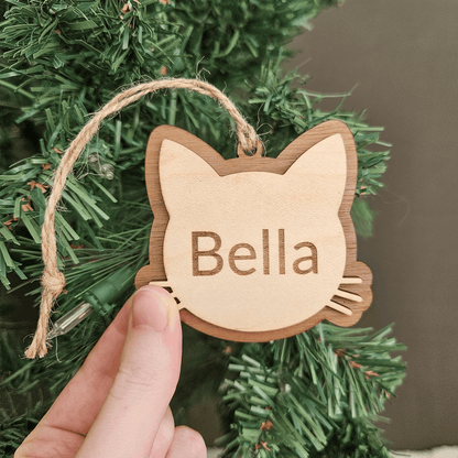 Engraved wooden cat ornament personalized with pet name Bella handmade in Montana