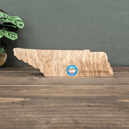 Back view of layered Tennessee wooden state art engraved with Rising Joy Creations logo and Made in Montana sticker.