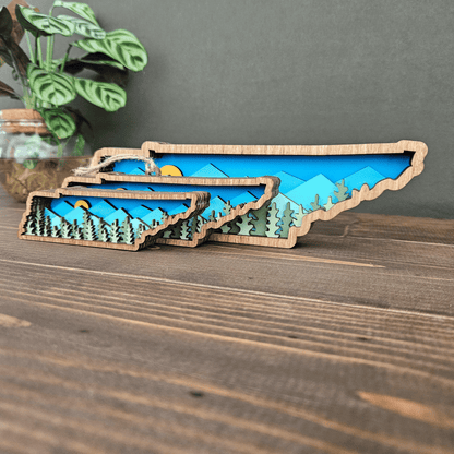 Angled view of layered Tennessee mountain art in mini, ornament, and small sizes — handmade wooden state decor with mountain design.