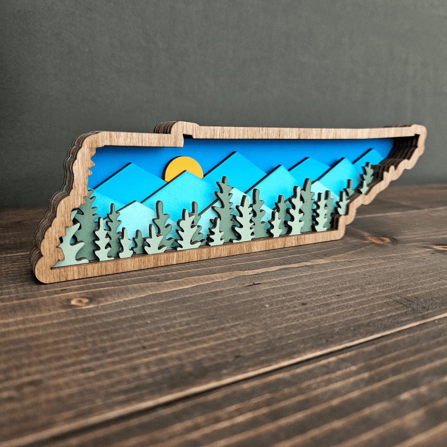 Angled side view of layered Tennessee wood art showing depth and 3D forest detail — handmade mountain state decor.