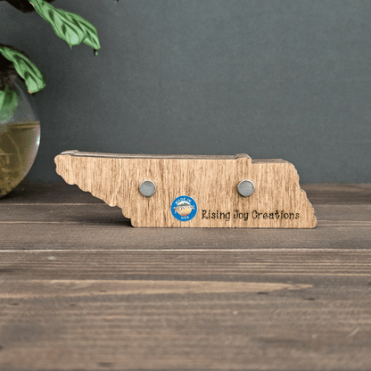 Back of mini Tennessee mountain magnet showing two strong magnets and engraved Rising Joy Creations logo — handmade in Montana.